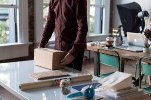 Creative small business workspace with laptop and packaging materials