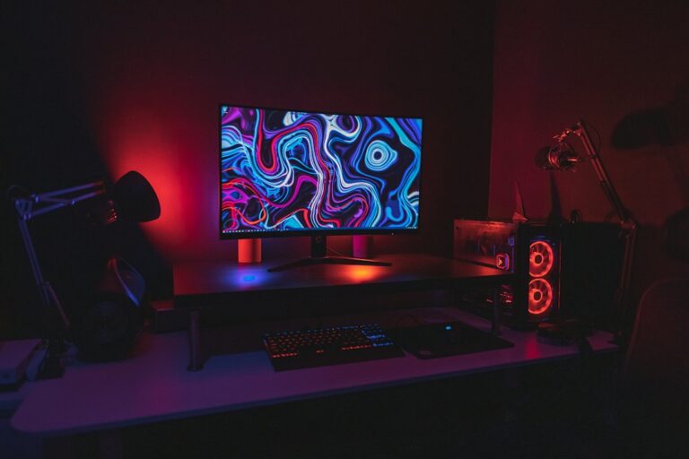 Bedroom and desk setup illuminated with LED strip lights